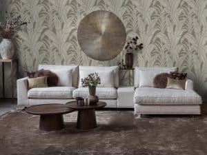 Corner sofa Claire in a light fabric. Interior styling with brown and natural accessories.