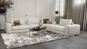 Beiges Sofa mit verschiedenen Elementen und ansprechendem rot/pinkem Innendesign.